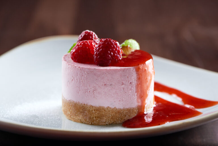 Close up shot of a delicious raspberry cheesecake decorated with raspberries copyspace cafe coffee shop restaurant confectionery bakery cooking pastry dessert sweets candy buffet.